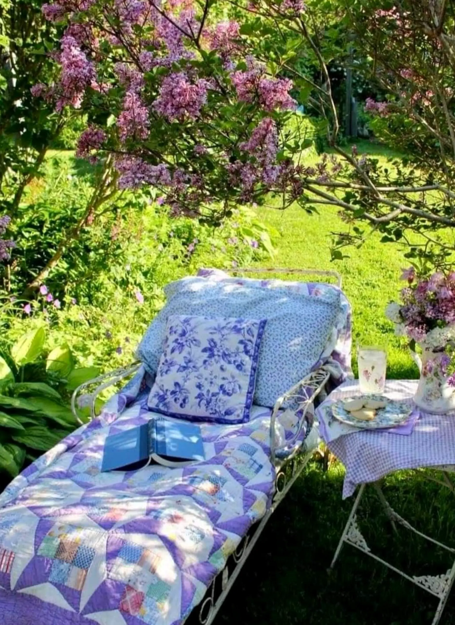 Quiet flower arrangement introduces texture into the setting, keeping the atmosphere open and lived-in.