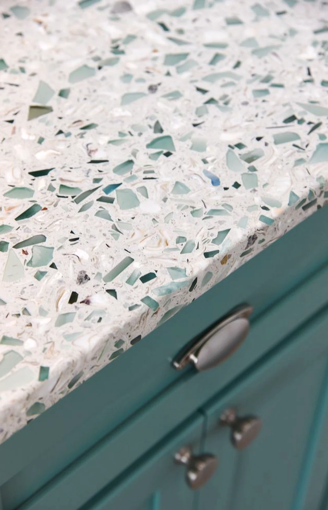 Calm stone terrace gives the garden edge more comfort, so the whole view feels easy to enjoy.