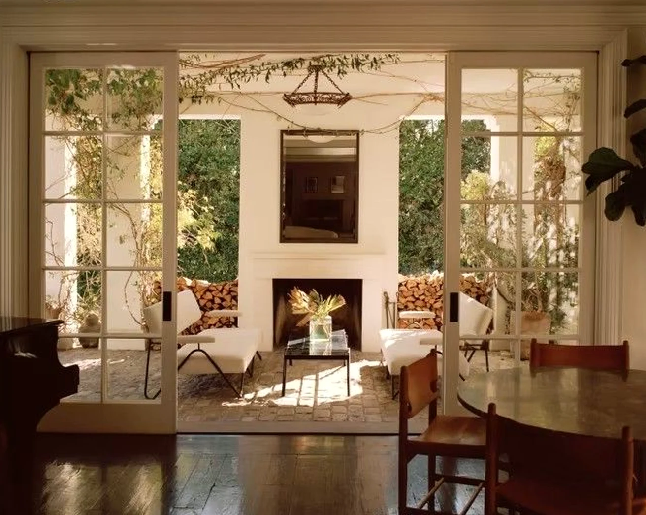 Relaxed entry console draws attention to light while the sitting area stays fresh and intentional.