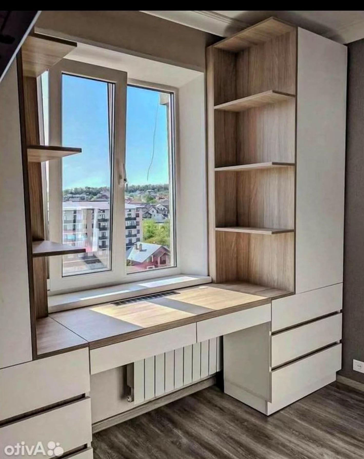 Leafy wood shelving brings a useful note of character, making the view feel personal and relaxed.