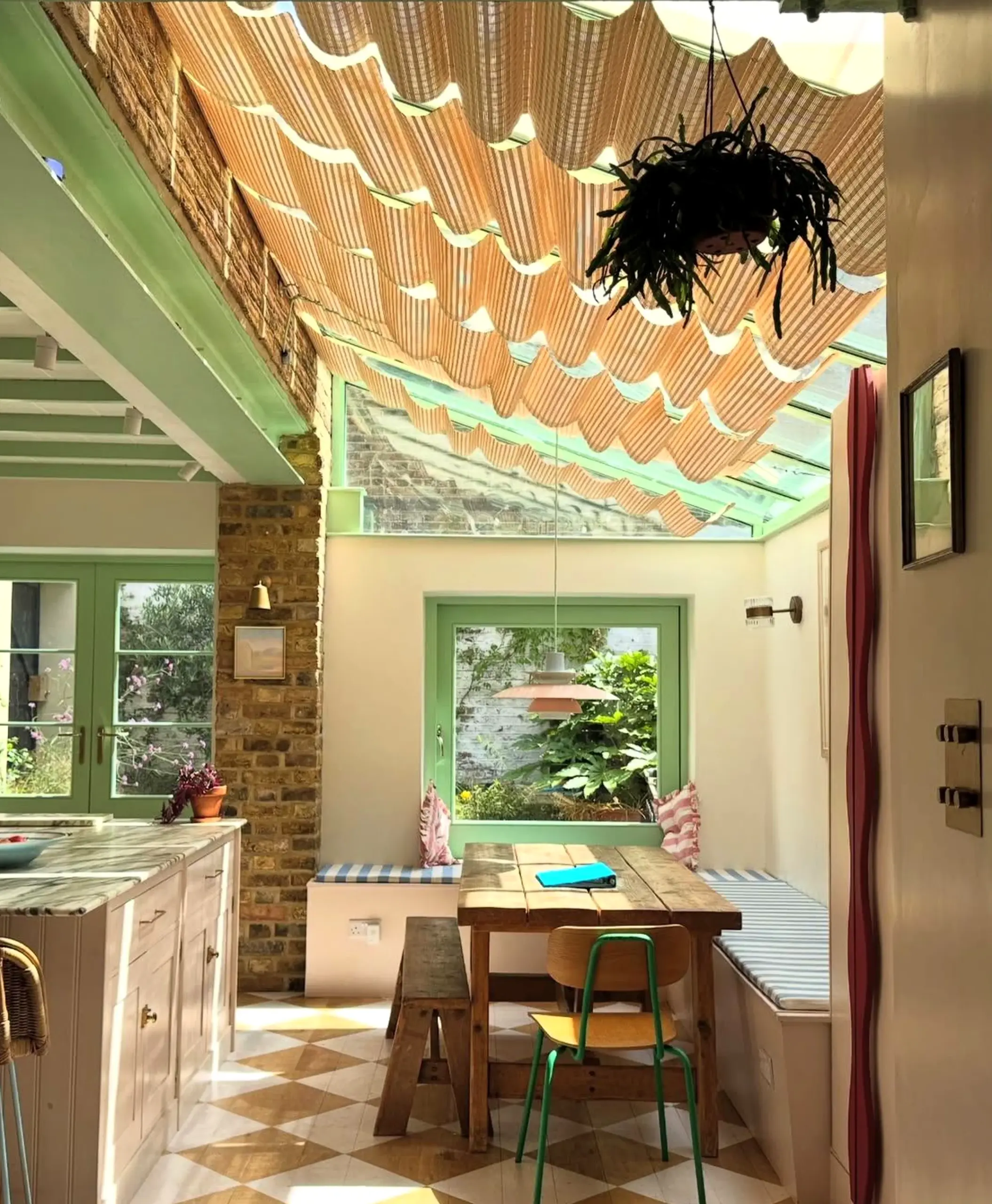 Balanced storage corner frames the garden edge with comfort, making the scene feel settled and welcoming.
