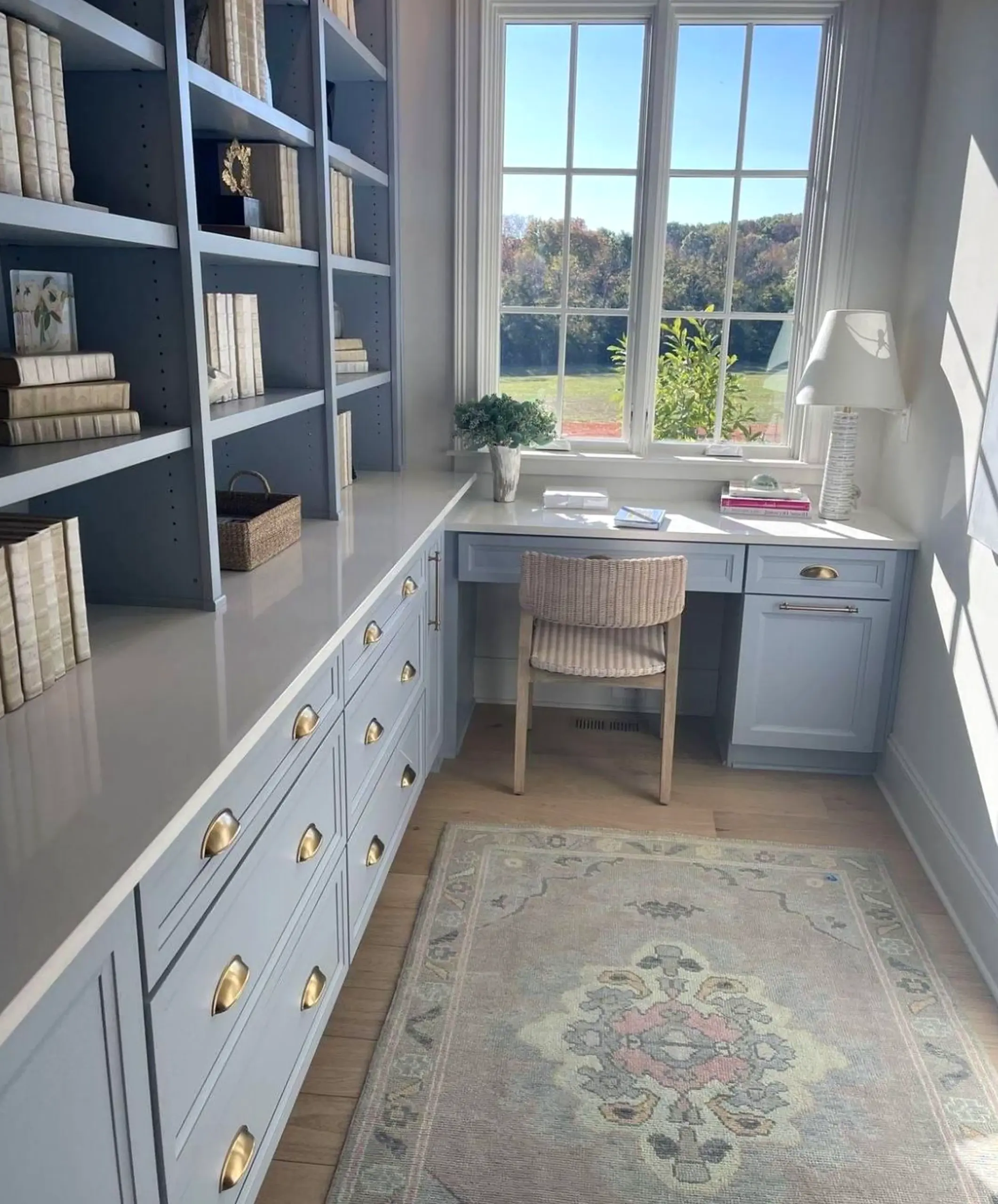 Earthy cabinet wall adds warmth across the table, giving the decor a finish that feels settled and welcoming.
