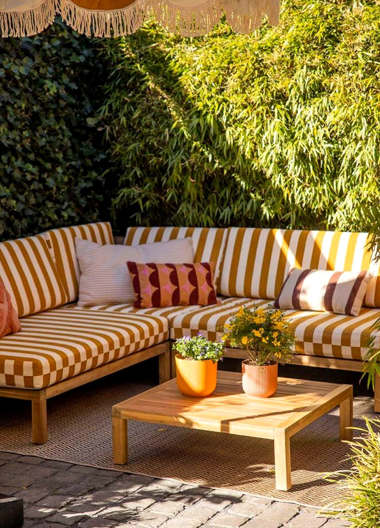 Luminous porch bench supports the corner through contrast, leaving the space feeling ready for quiet use.